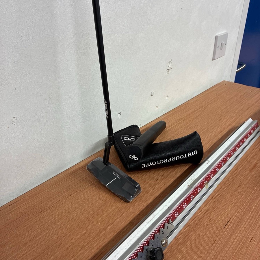 A custom putter on the length gauge